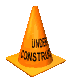 a classic pixelated gif from the 90s internets. a traffic cone whirls and whirls forever. Printed on it are the words Under Construction